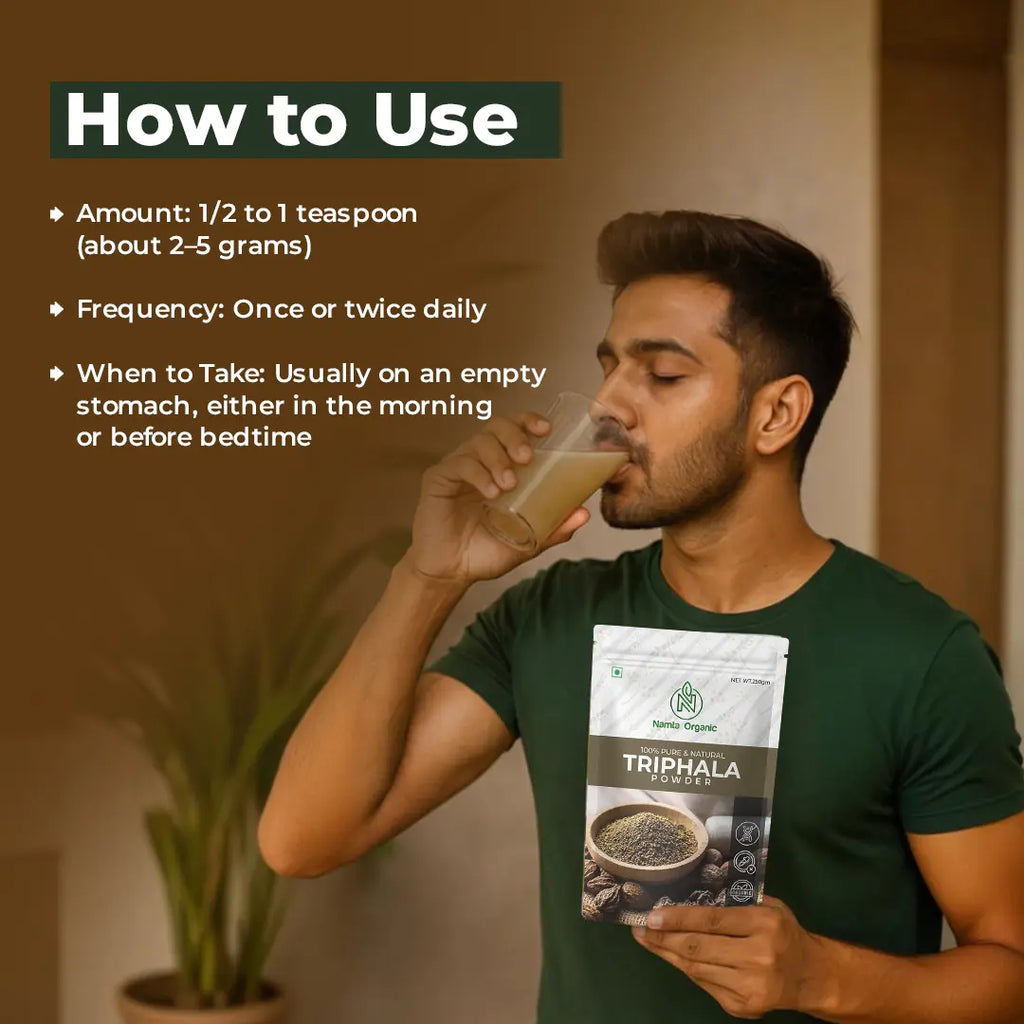 Man drinking a glass of juice Triphala powder and holds a packet of organic Triphala powder